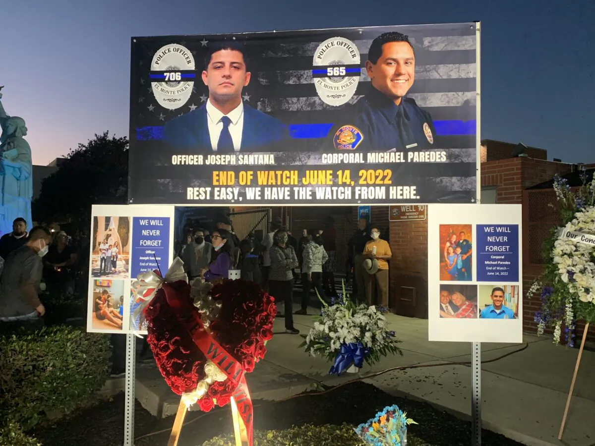 In honor of two El Monte police officers killed in a recent motel shooting, hundreds of community members, law enforcement officers, and family members gathered at a candlelight vigil outside the El Monte Civic Center in El Monte, Calif., on June 18, 2022. (Linda Jiang/The Epoch Times)