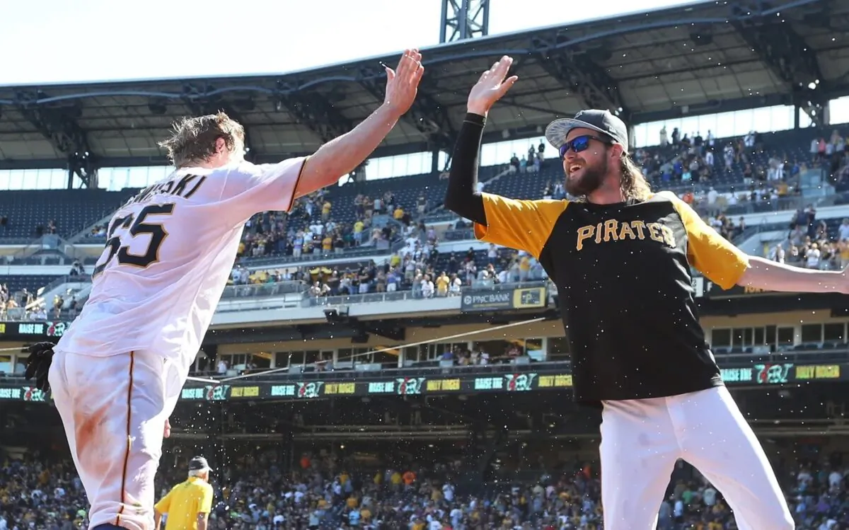 Pittsburgh Pirates right fielder Jack Suwinski (L) high fives pitcher JT Brubaker after Suwinski hit three solo home runs including a walk off game winner in the ninth inning against the San Francisco Giants at PNC Park in Pittsburgh on June 19, 2022. (Charles LeClaire/USA TODAY Sports via Field Level Media)
