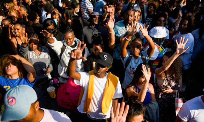 In this file photo, people attend the Leimert Park Rising Juneteenth celebration to mark the end of slavery, in the Leimert Park neighborhood of Los Angeles on June 19, 2021. (Patrick T. Fallon/AFP via Getty Images)
