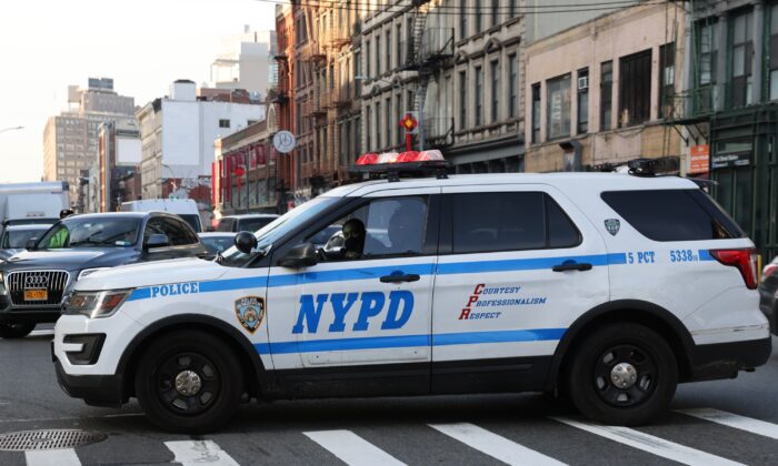 A police car drives through the Manhattan borough of New York City on Jan. 14, 2021. (Spencer Platt/Getty Images)