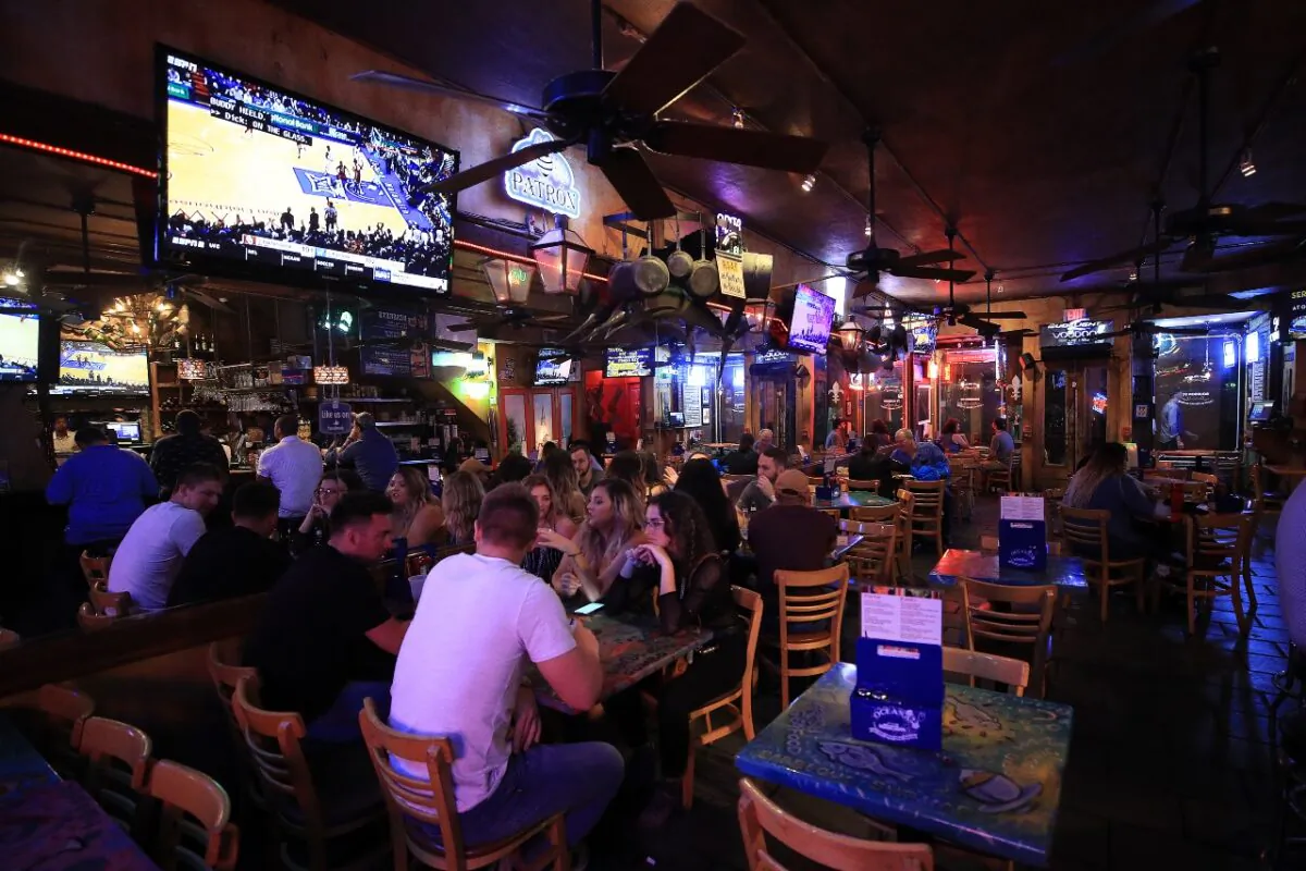 People eat at Oceana Grill on Bourbon Street as Louisiana Governor John Bel Edwards orders bars, gyms and casinos to close until April 13th due to the spread of COVID-19 on March 16, 2020 in New Orleans, Louisiana. Oceana Grill sued Lloyd’s of London to cover losses caused by the government-ordered closures due to the coronavirus. (Chris Graythen/Getty Images)