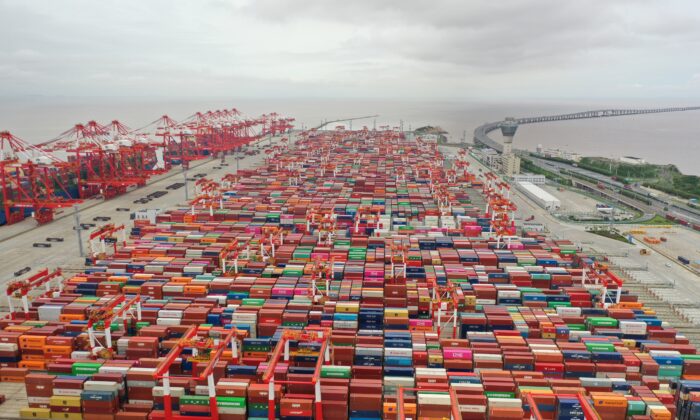 Aerial view of shipping containers stacked at Yangshan Deepwater Port in Shanghai, China, on May 19, 2021. (Shen Chunchen/VCG via Getty Images)