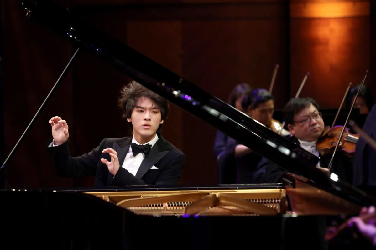 Yunchan Lim of South Korea performs a concerto with the Fort Worth Symphony Orchestra conducted by Chairman of the Jury Marin Alsop in the final round of the 16th Van Cliburn International Piano Competition at Bass Performance Hall in Fort Worth, Texas, on June 12, 2022. (Richard Rodriguez/The Cliburn via AP)