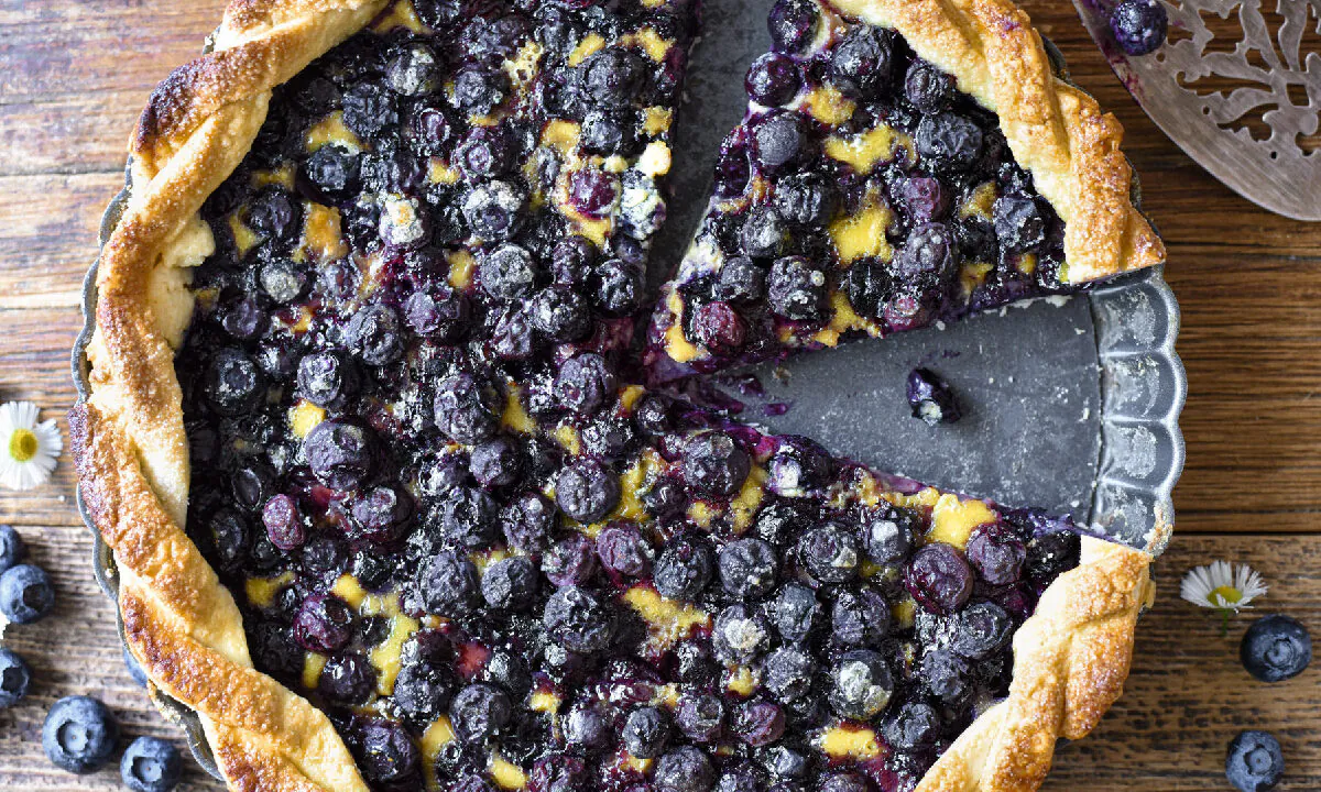 Blueberries in the spotlight: The simple, buttery crust and mellow custard filling allow the real stars of this show to shine. (Audrey Le Goff)