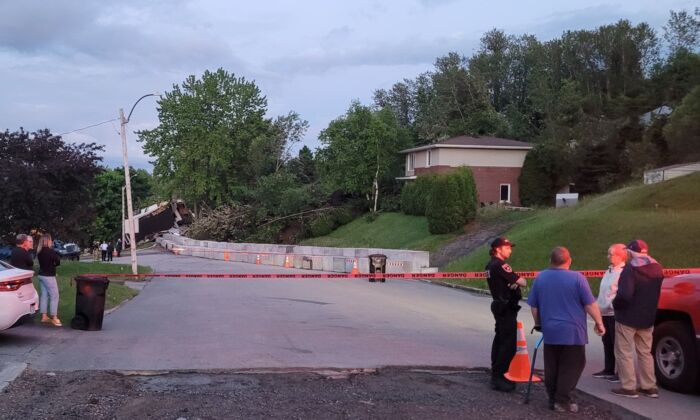 A house is destroyed in a neighbourhood of Saguenay, Que., north of Quebec City, following a landslide last week, as seen in this handout image provided June 20, 2022. (The Canadian Press/HO-Marie-Chantale Tremblay)
