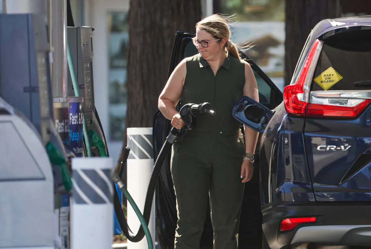 A customer prepares to pump gas into her car at a Chevron gas station in San Rafael, Calif., on May 20, 2022. (Justin Sullivan/Getty Images)
