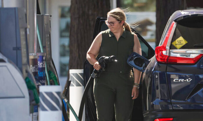 A customer prepares to pump gas into her car at a Chevron gas station in San Rafael, Calif., on May 20, 2022. (Justin Sullivan/Getty Images)