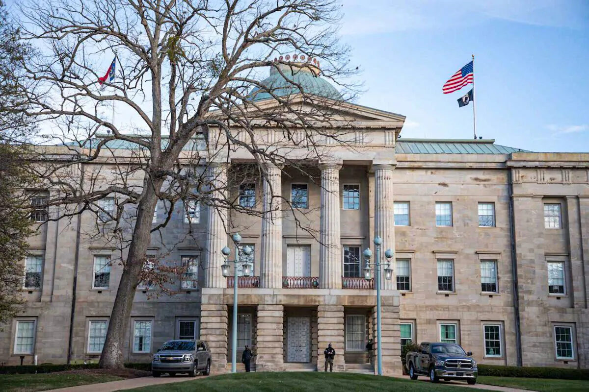 Law enforcement stand guard outside of the state capitol building in downtown Raleigh, N.C., on Jan. 17, 2021. (Logan Cyrus/AFP via Getty Images)