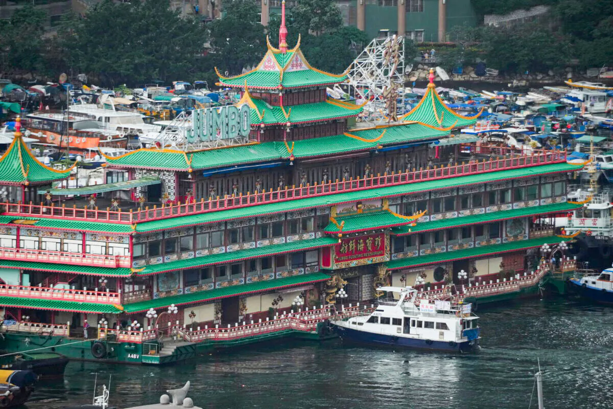 Hong Kong's iconic Jumbo Floating Restaurant is towed away in Hong Kong on June 14, 2022. (Kin Cheung/AP Photo)