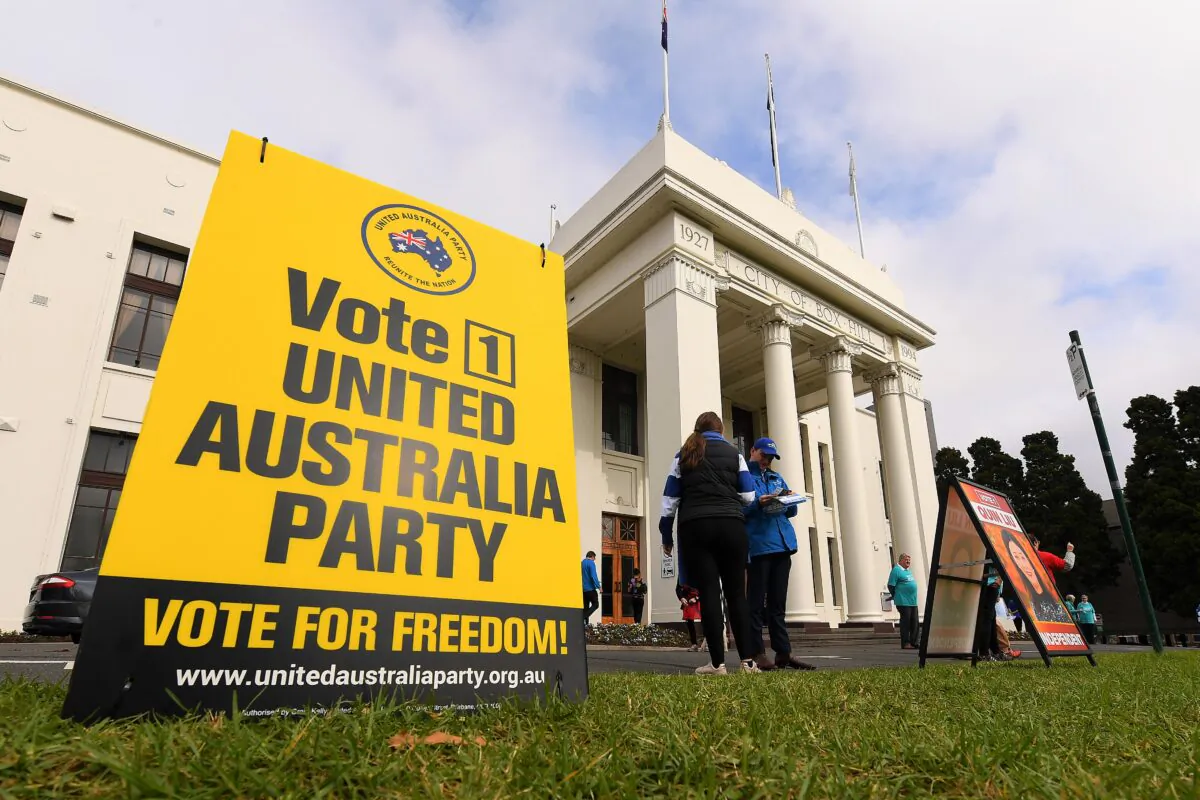 A corflute sign for the United Australia Party is seen outside the Australian Electoral Commission in Melbourne, Australia, on May 13, 2022. (AAP Image/James Ross)