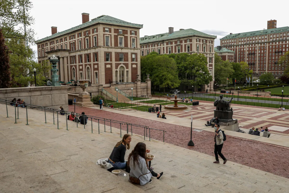 Students sit on the steps at Columbia University in Manhattan on May 10, 2021. (Samira Bouaou/The Epoch Times)