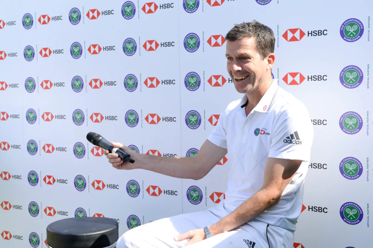 Tim Henman participates in a Wimbledon press conference with a twist, on HSBC's Court 20 at Wimbledon in London on July 2, 2019. (Nicky J Sims/Getty Images for HSBC)