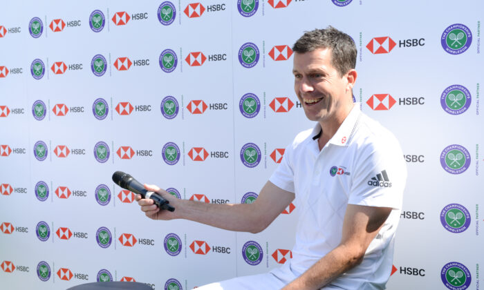 Tim Henman participates in a Wimbledon press conference with a twist, on HSBC's Court 20 at Wimbledon in London on July 2, 2019. (Nicky J Sims/Getty Images for HSBC)