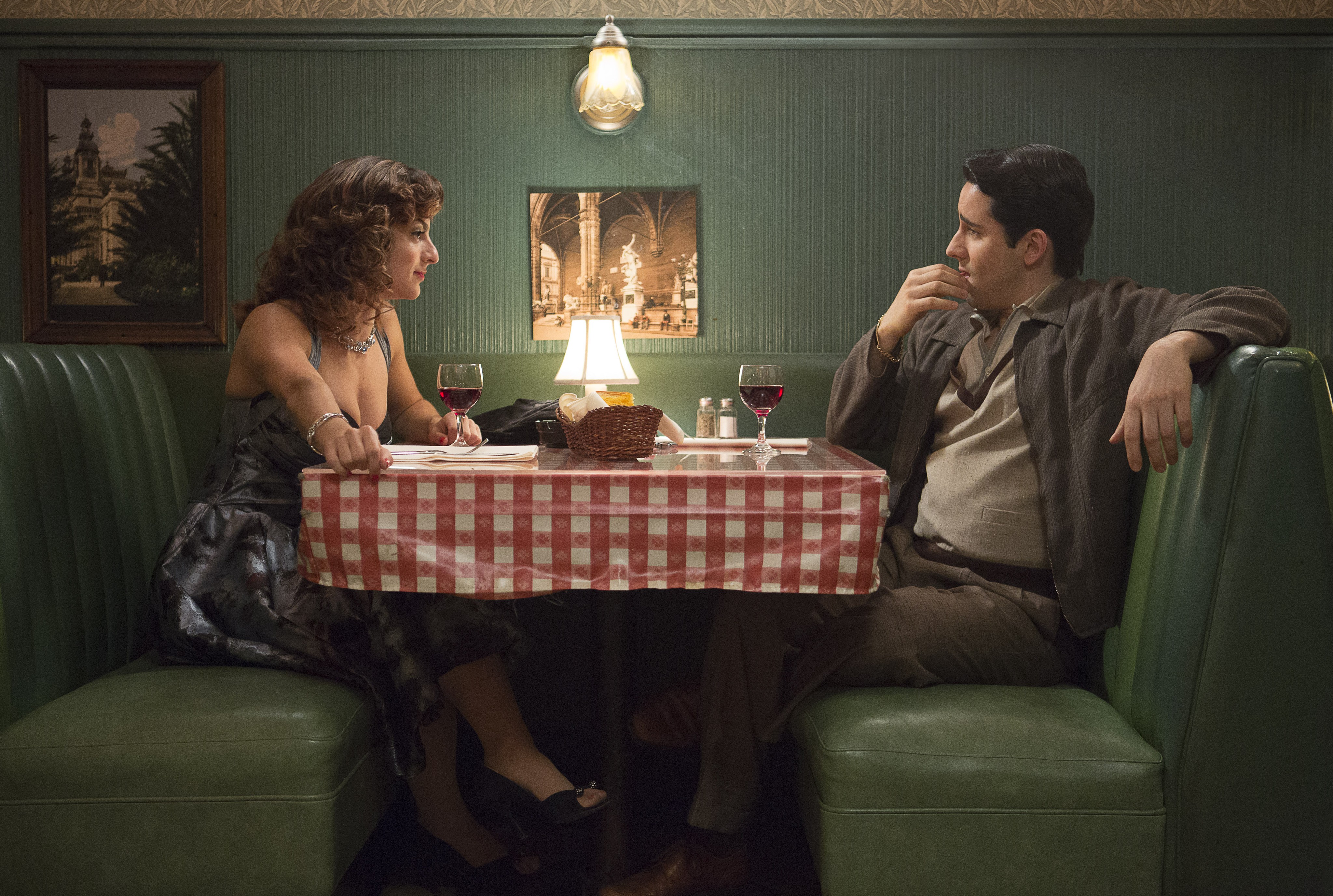 man and woman at restaurant table in JERSEY BOYS 