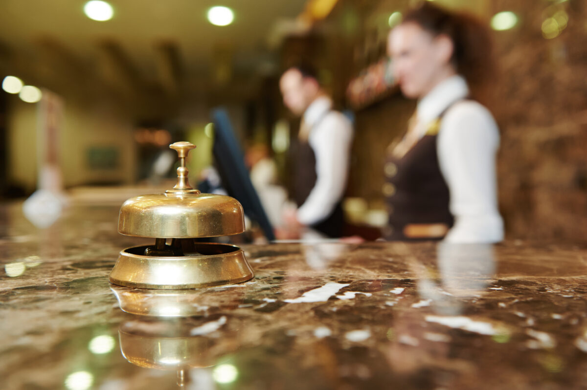 Hotel reception with bell. (Dreamstime)