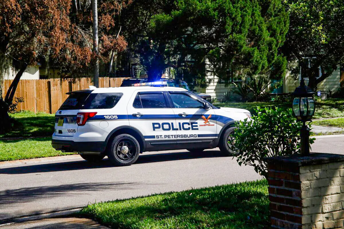 A police patrol car drives through a residential neighborhood in St. Petersburg, Fla., on Sept. 9, 2017. (Brian Blanco/Getty Images)
