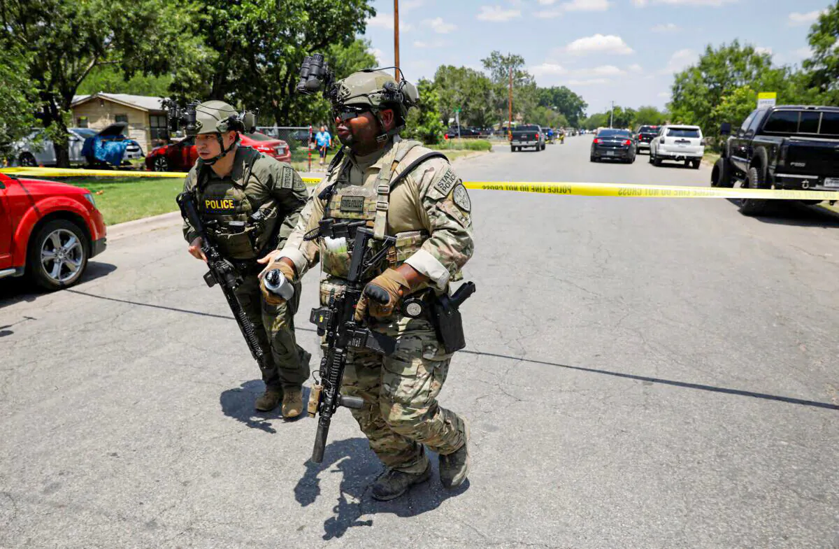 Law enforcement personnel guard the scene of a shooting at Robb Elementary School in Uvalde, Texas, on May 24, 2022. (Marco Bello/Reuters)