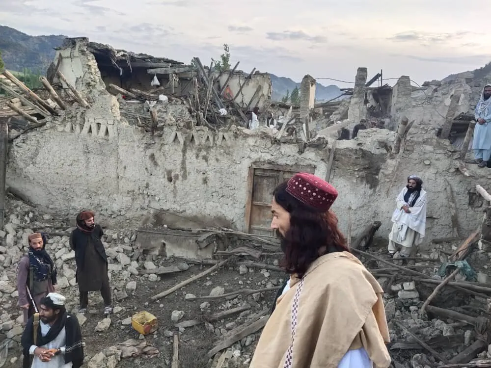 Afghans look at destruction caused by an earthquake in the province of Paktika, eastern Afghanistan, on June 22, 2022. (Bakhtar News Agency via AP)
