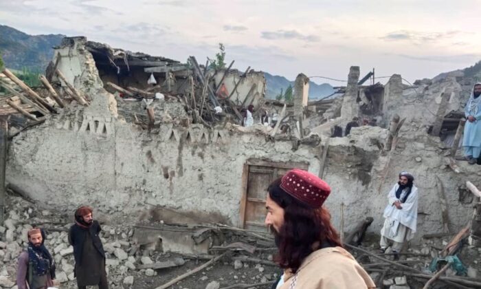  Afghans look at destruction caused by an earthquake in the province of Paktika, eastern Afghanistan, on June 22, 2022. (Bakhtar News Agency via AP)