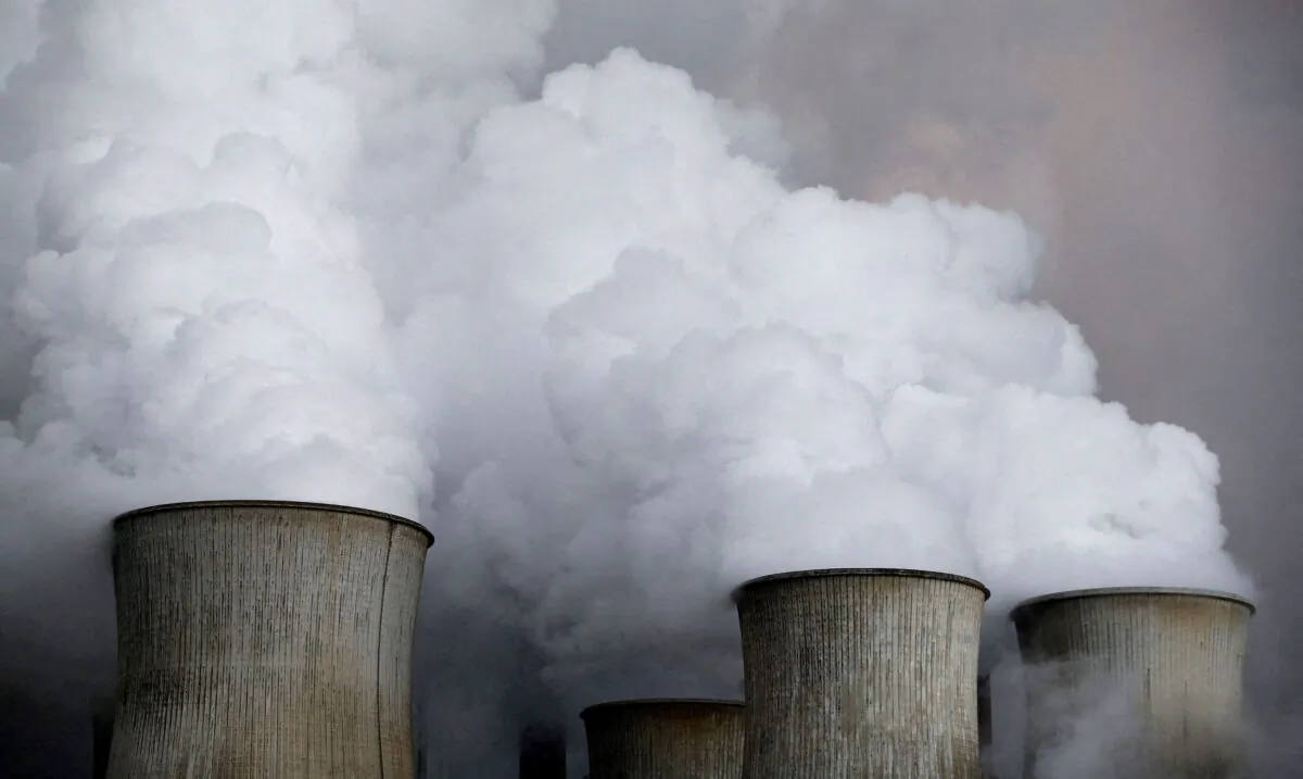 Steam rises from the cooling towers of the coal power plant of RWE, one of Europe's biggest electricity and gas companies in Niederaussem, Germany, on March 3, 2016. (Wolfgang Rattay/Reuters)