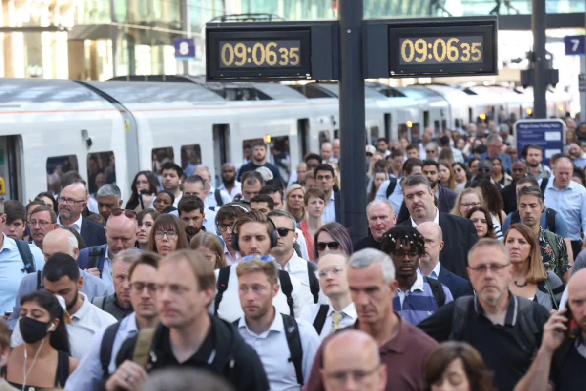 Passengers arrive at Kings Cross Station, London, on June 22, 2022. (James Manning /PA Media)