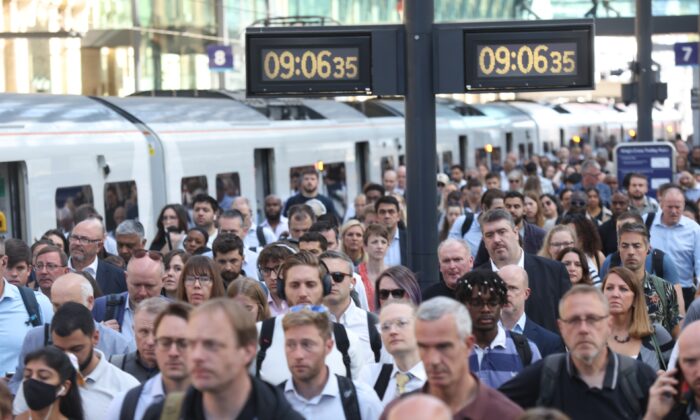 Passengers arrive at Kings Cross Station, London, on June 22, 2022. (James Manning /PA Media)