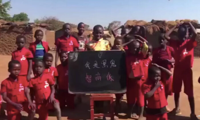 In a racist short video made for a Chinese audience, kids in a Malawian village unknowlingly chant in Chinese "I am a black monster and my IQ is low." (Screenshot via The Epoch Times) 