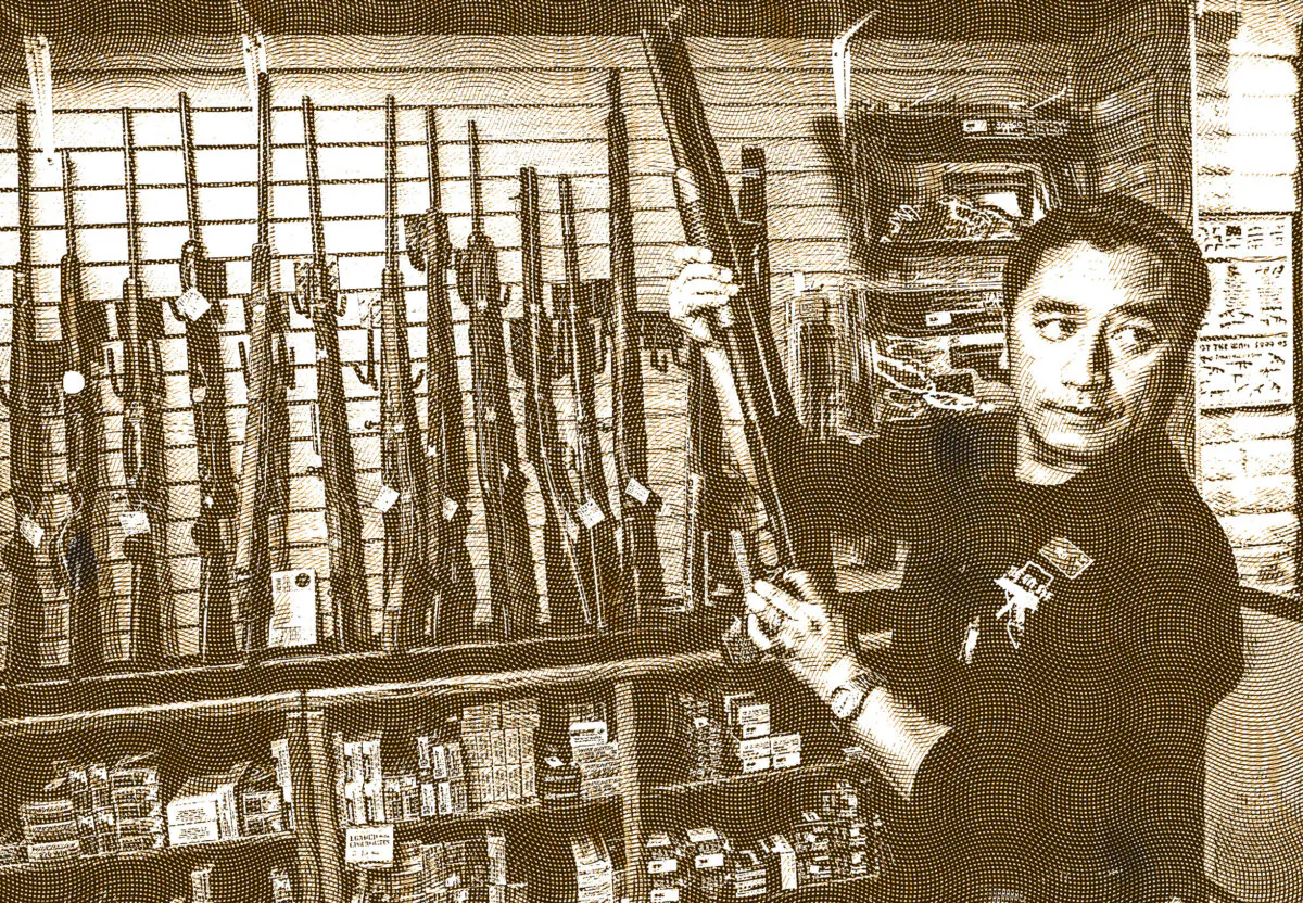 A gun store rangemaster shows a customer a shotgun in Las Vegas, in this file photo. 
(Ethan Miller/Getty Images)