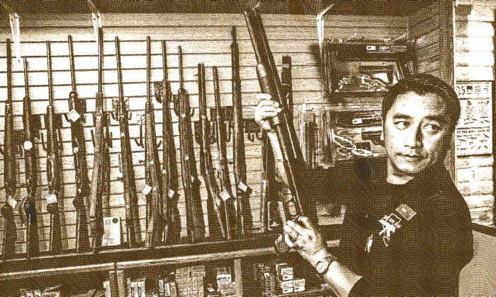 A gun store rangemaster shows a customer a shotgun in Las Vegas, in this file photo. 
(Ethan Miller/Getty Images)