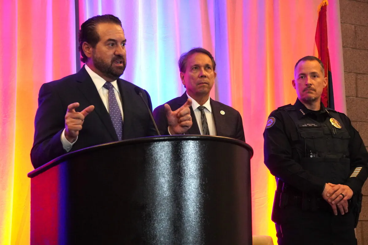 Arizona Attorney General Mark Brnovich (L) discusses the problem of human trafficking in Arizona at a press conference in Scottsdale, Ariz., on June 22. Scottsdale Mayor David Ortega (C) and Scottsdale Police Chief John Walther (R) spoke about the city's efforts to combat the problem through a partnership with the Arizona Anti-Trafficking Network and Homeland Security Investigations. (Allan Stein/The Epoch Times)