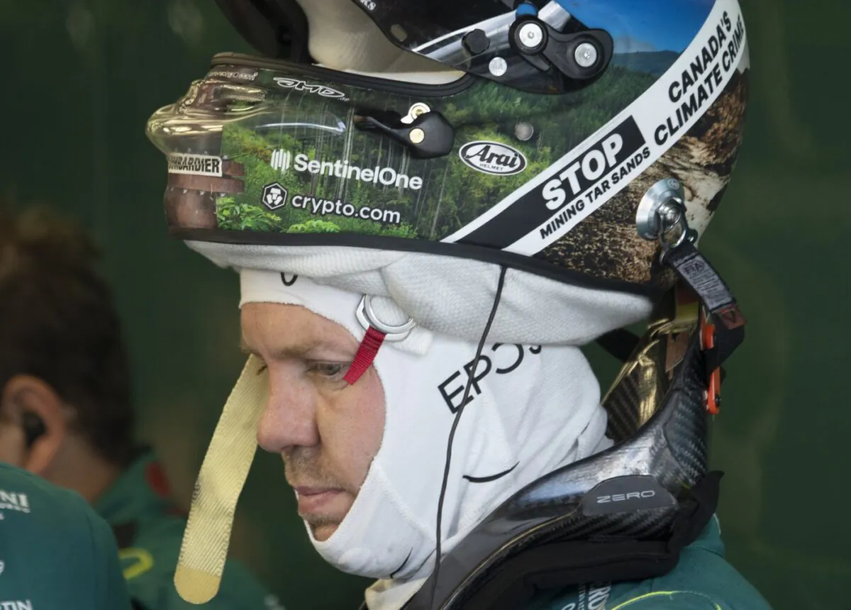 Aston Martin Formula 1 driver Sebastian Vettel, of Germany, wears a patch on his helmet denouncing Canada's oilsands during the first practice session at the Canadian Grand Prix, in Montreal, June 17, 2022. (The Canadian Press/Ryan Remiorz)