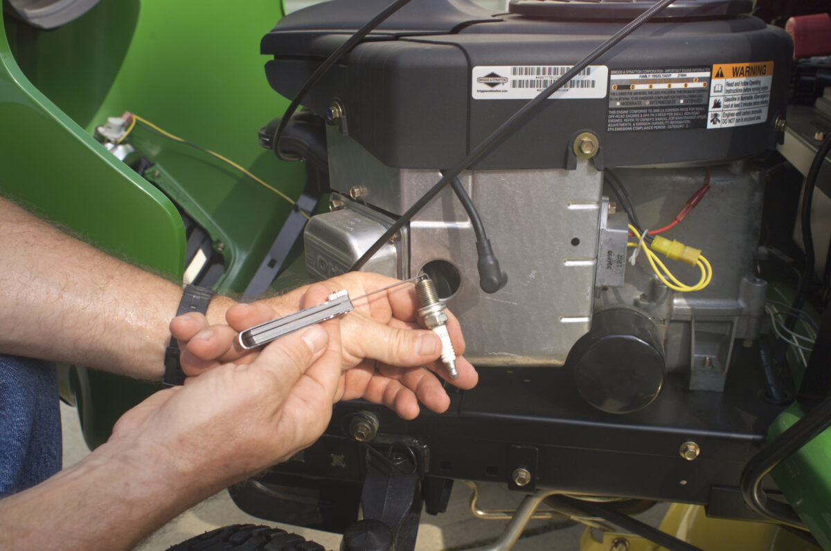 A riding lawn tractor requires regular maintenance. (John Deere/TNS)