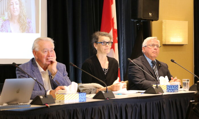 Panelists at "A Citizens' Hearing," an independent inquiry of Canada's pandemic response, listen to stories of Canadians adversely affected by COVID-19 vaccine mandates and restrictions, in Toronto on June 23, 2022. (L–R) Former Party leader and MP Preston Manning, retired Ontario pediatrician Dr. Susan Natsheh, and David Ross, president of the Canadian COVID Care Alliance. (Andrew Chen/The Epoch Times)