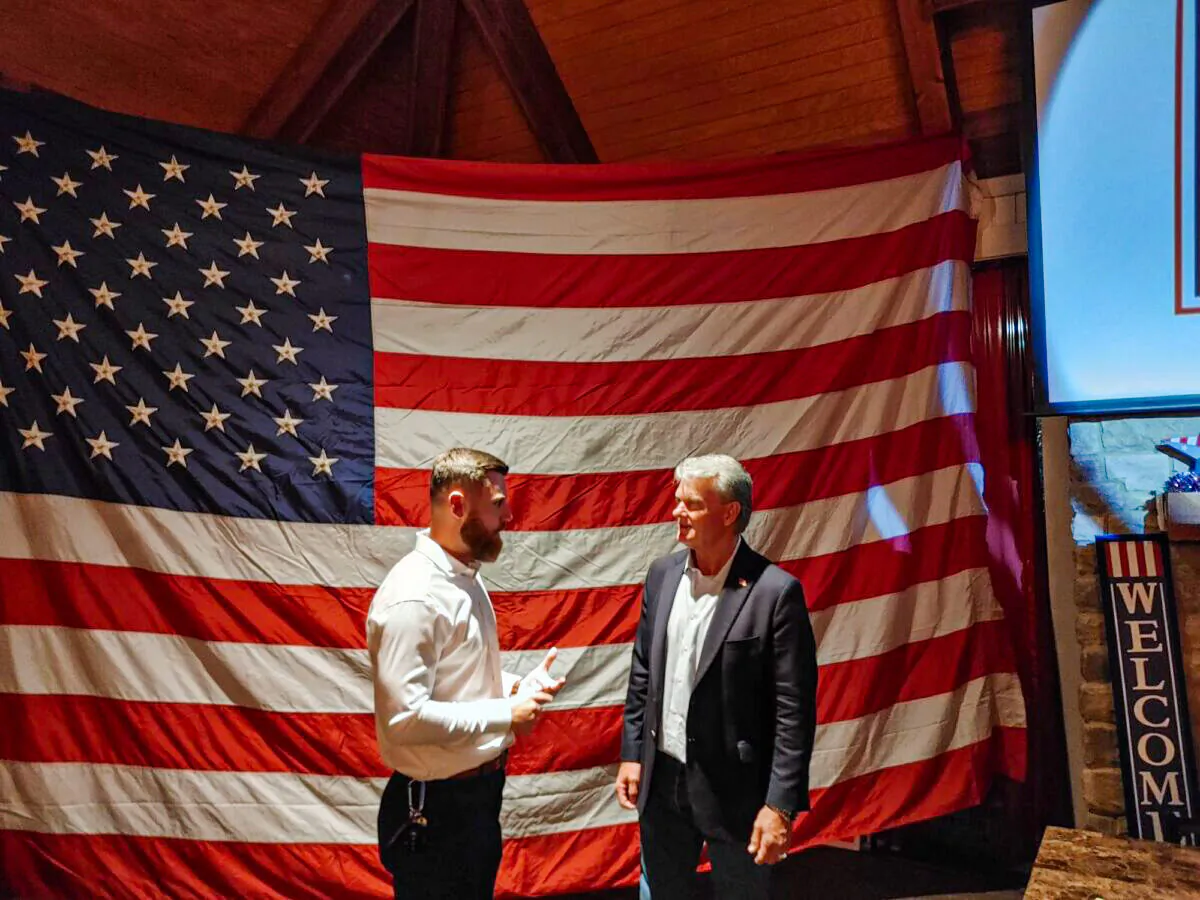 Jackson trucking company owner and lifelong 10th Congressional District resident Mike Collins talks to a TV reporter after his GOP runoff victory on June 21, 2022, in Jackson, Georgia. (Jeff Louderback/Epoch Times)