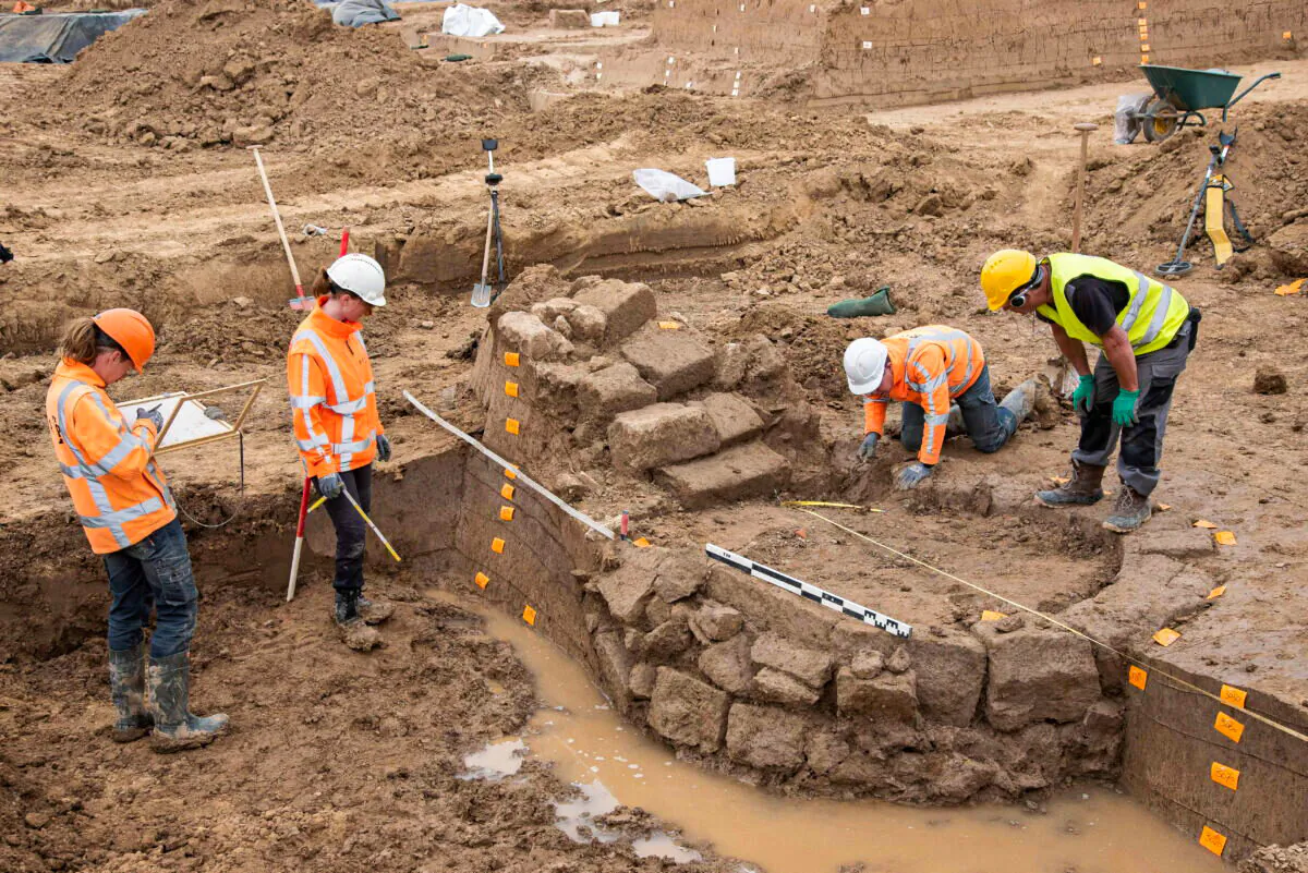 People work on a site where archaeologists discovered a Roman temple in Zevenaar, central-east Netherlands, on April 29, 2022. (RAAP/Handout via Reuters)