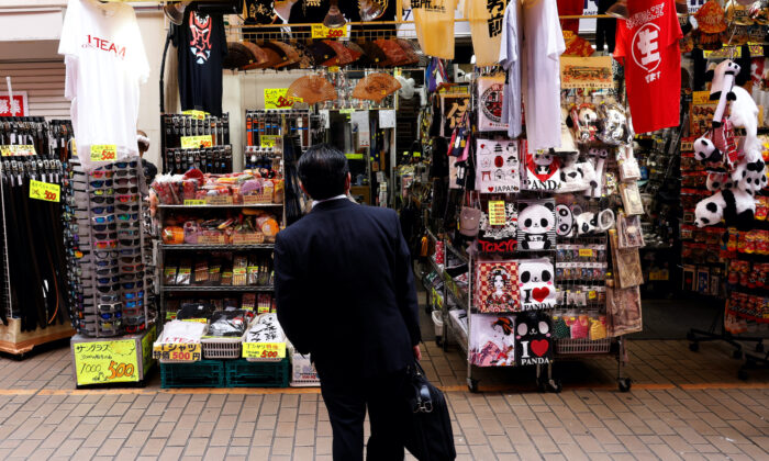 A man looks at a shop at the Ameyoko shopping district in Tokyo on May 20, 2022. (Kim Kyung-Hoon/Reuters)