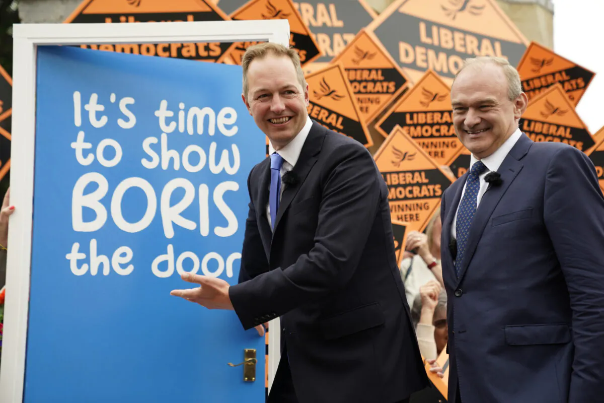 Liberal Democrat Leader Sir Ed Davey (right) celebrates with Richard Foord, the newly-elected Liberal Democrat MP for Tiverton and Honiton, with supporters and activist at the Lowman Green Clock Tower in Tiverton, on June 24, 2022. (Andrew Matthews /PA Media)