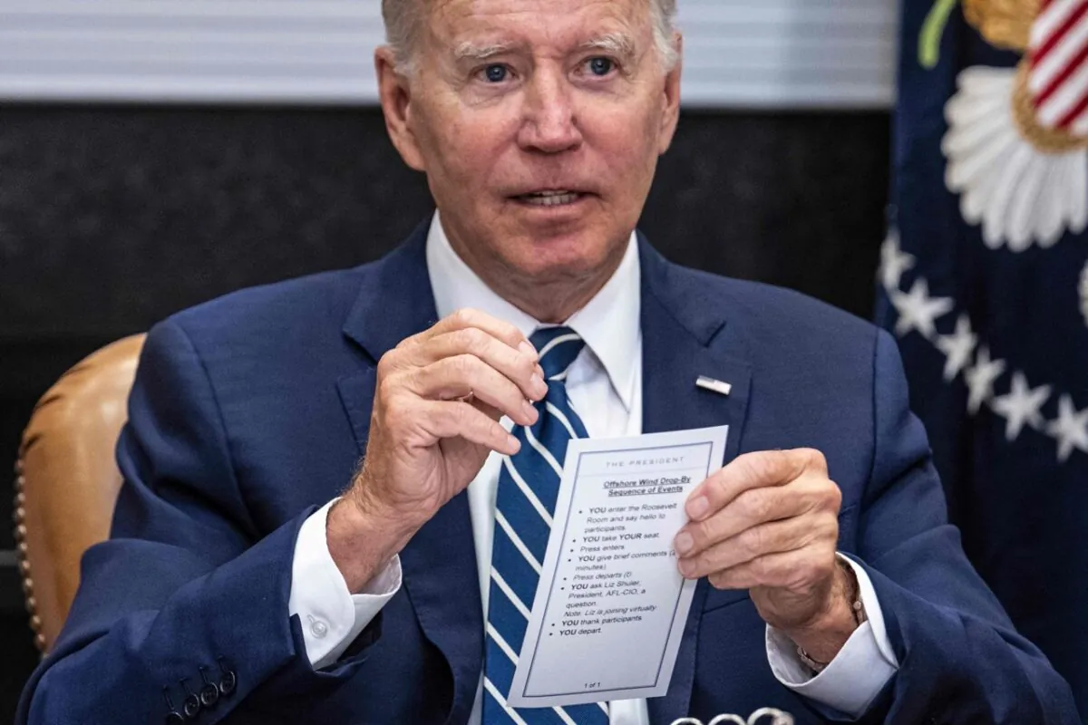 President Joe Biden speaks from his notes with governors, labor leaders, and private companies launching the Federal-State Offshore Wind Implementation Partnership as he drops by a meeting at the White House in Washington on June 23, 2022. (Jim Watson/AFP via Getty Images)