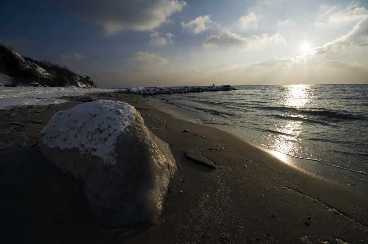 Frozen seawater covers a rock on the shore near the city of Ronne on the Danish island of Bornholm in the Baltic Sea on Feb. 5, 2012. (Jonathan Nackstrand/AFP via Getty Images)