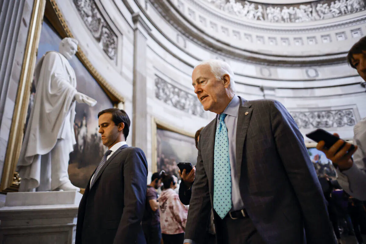 Senate Minority Whip John Cornyn (R-Texas) talks to reporters as he walks through the U.S. Capitol Rotunda in Washington on June 23, 2022. (Chip Somodevilla/Getty Images)