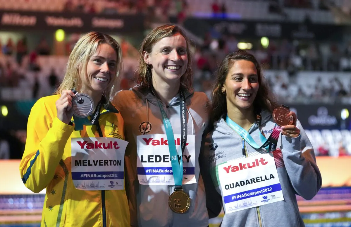 (L–R) Silver medalist Kiah Melverton of Australia, gold medalist Katie Ledecky of the United States, and bronze medalist Simona Quadarella of Italy, pose with their medals after the Women's 800m Freestyle final at the 19th FINA World Championships in Budapest, Hungary, on June 24, 2022. (Petr David Josek/AP Photo)