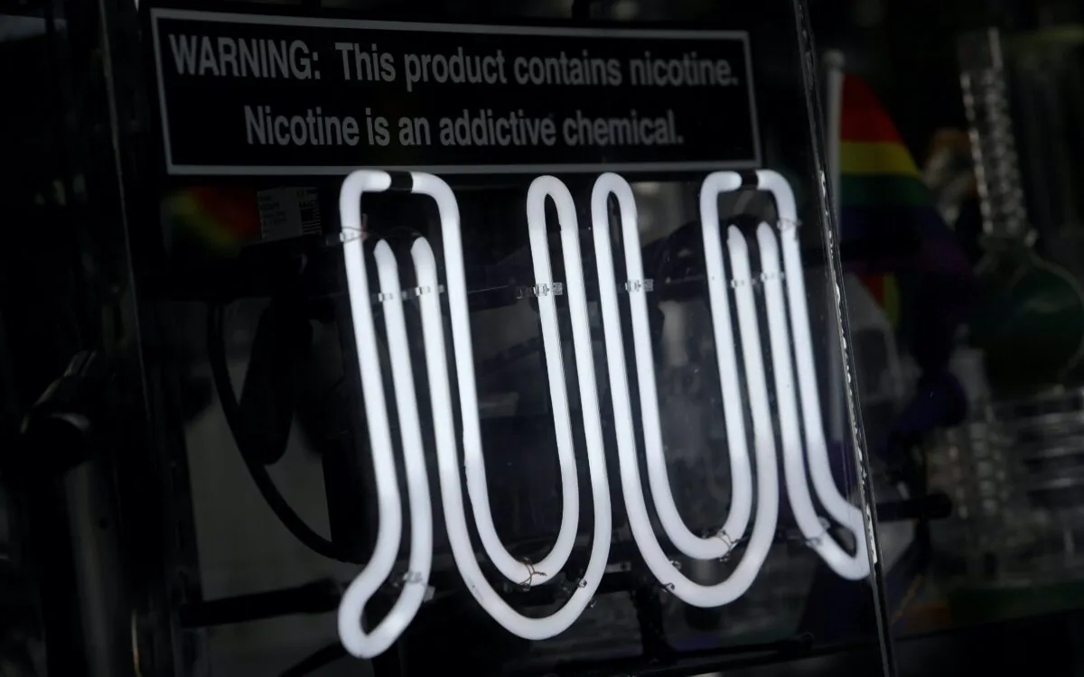 Signage for Juul vaping products is seen on a storefront in New York City on Sept. 9, 2019. (Andrew Kelly/AP Photo)