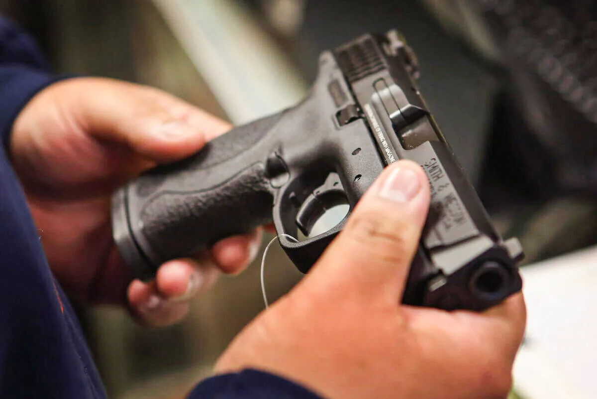 A customer shops for a pistol in Tinley Park, Ill., on Dec. 17, 2012. (Scott Olson/Getty Images)