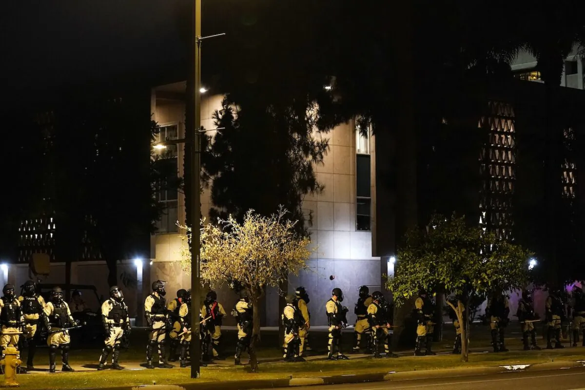 Riot police surround the Arizona Capitol after protesters reached the front of the Arizona Sentate building following the Supreme Court's decision to overturn Roe v. Wade, in Phoenix, on June 24, 2022. (Ross D. Franklin/AP Photo)