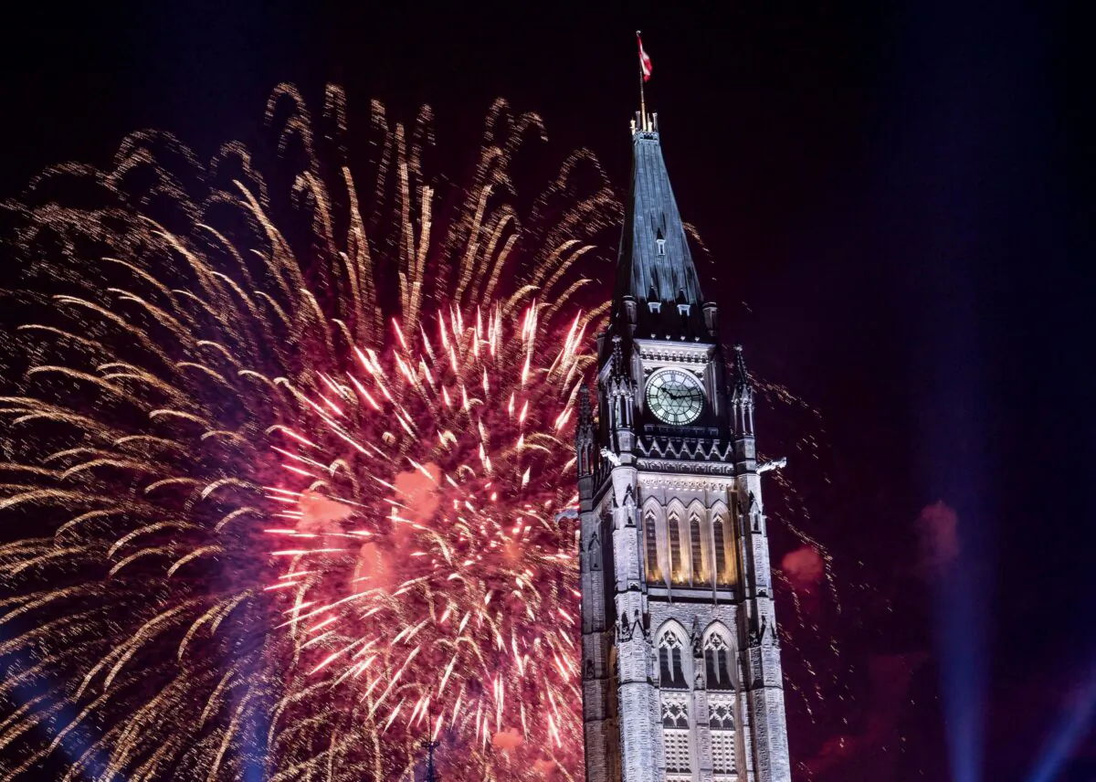 Fireworks explode over the Peace Tower on Parliament Hill at the end of Canada Day celebrations in Ottawa on July 1, 2018. (The Canadian Press/Justin Tang)