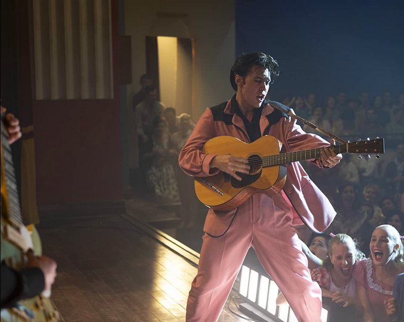 man in pink suit with guitar in ELVIS 