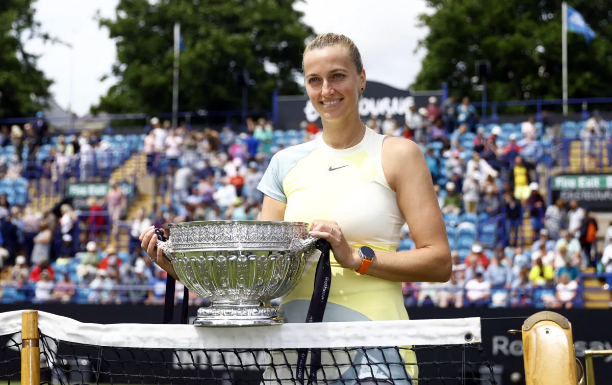 Czech Republic's Petra Kvitova poses with the trophy after winning the Eastbourne International women's final against Latvia's Jelena Ostapenko in Devonshire Park Lawn Tennis Club, Eastbourne, Britain on June 25, 2022. (Andrew Boyers/Reuters)