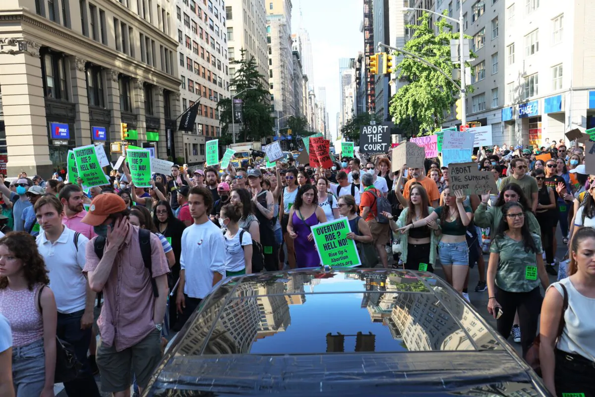 People march as they protest the Supreme Court's decision to overturn Roe v. Wade, in New York on June 24, 2022. (Michael M. Santiago/Getty Images)