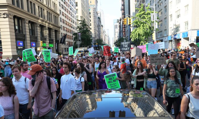 People march as they protest the Supreme Court's decision to overturn Roe v. Wade, in New York on June 24, 2022. (Michael M. Santiago/Getty Images)