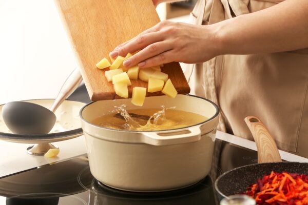 someone boiling potatoes